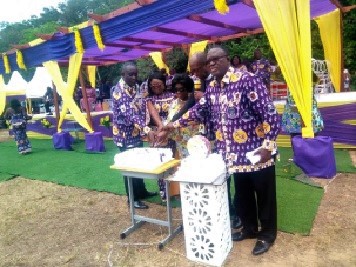 Ms Dapaah (middle) together with the headmistress and other dignitaries cutting the anniversary cake
