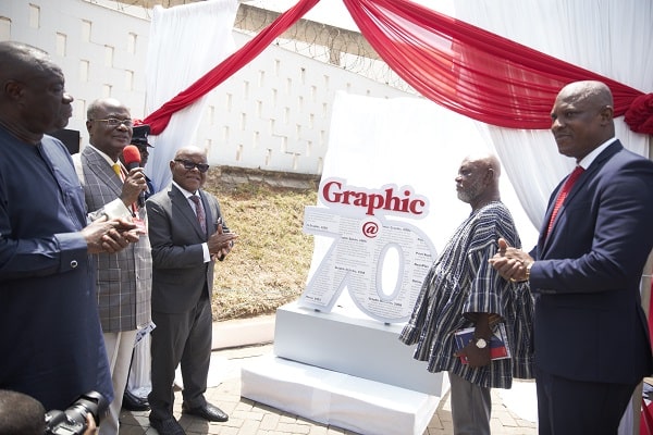 Professor Aaron Mike Oquaye (3rd left) applauding after unveiling the anniversary logo at the 70th anniversary launch of the Graphic Communications Group Limited (GCGL). Looking on are Professor Kwame Karikari (in smock), Board Chairman of GCGL; Mr Ato Afful (right), the Managing Director of GCGL, and Dr Ibrahim Mohammed Awal (left), the Minister for Business Development. Picture: SAMUEL TEI ADANO