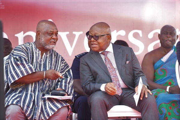 Professor Kwame Karikari (smock) in a chat with Prof. Aaron Mike Oquaye
