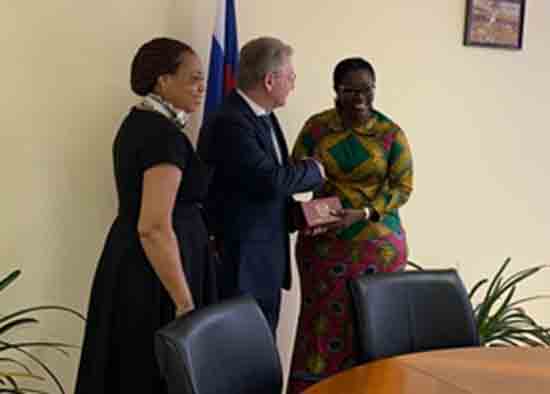 Mrs. Ursula Owusu-Ekuful (MP) presenting a gift to Mr. Grigory Ivliev,  with Ghana’s Ambassador to Russia, Dr. Lesley Akyaa Opoku Ware in attendance.