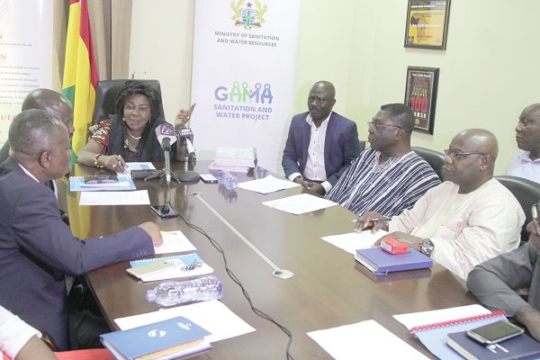Ms Cecilia Abena Dapaah (at the head of table), Minister of Sanitation and Water Resources, making some remarks after the agreements had been signed