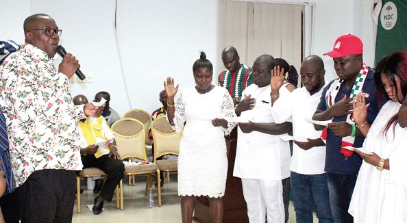 Mr Samuel Ofosu Ampofo (left) swearing in members of the Greater Accra Youth Wing Working Committee Picture: Patrick Dickson  