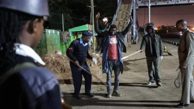 Police officers have been taking a tough line to implement the curfewImage caption: Police officers have been taking a tough line to implement the curfew
