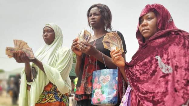 Recipients received a naira payment worth $52Image caption: Recipients received a naira payment worth $52