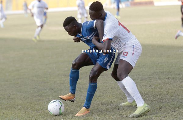 Abdul-Razak Yusif of Olympics (left)  being challenged by Liberty Professionals defender Mohammed Adams. Picture: SAMUEL TEI ADANO