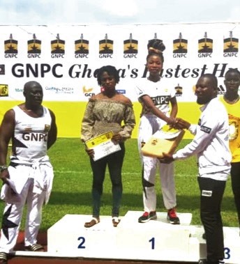 Grace Obour receiving her certificate after winning the race