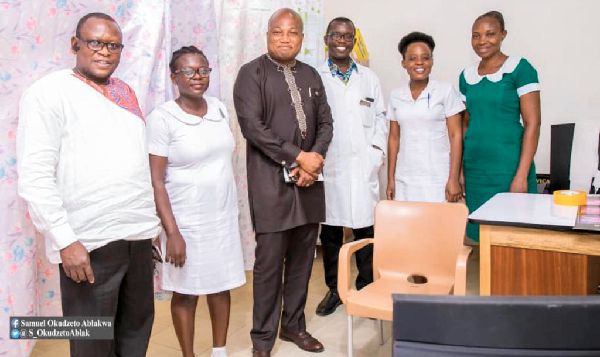 Mr Samuel Okudzeto Ablakwa (3rd left) with medical personnel after the donation
