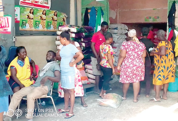 Some residents bying foodstuffs at the Tema Community 1 market.
