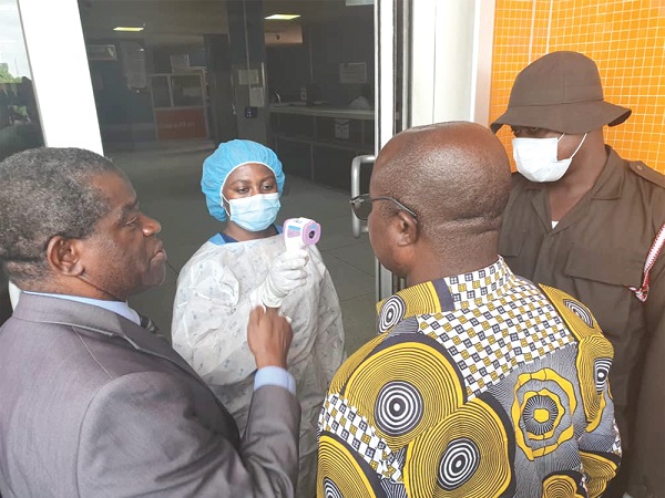 Mr Osei Assibey Antwi (arrowed) in a chat with officials of the Komfo Anokye Teaching Hospital