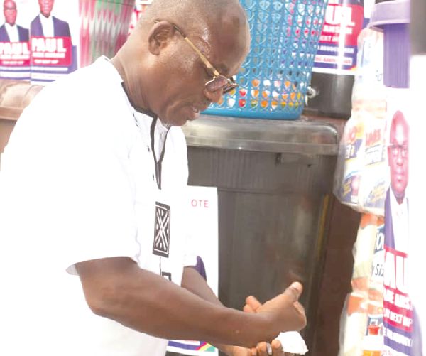  Mr Paul Asare Ansah demonstrating handwashing with soap to the public