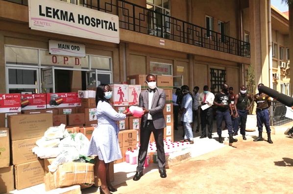 Dr Bernard Okoe-Boye (right) handing over the PPE to Dr Akua Gyimah-Asante