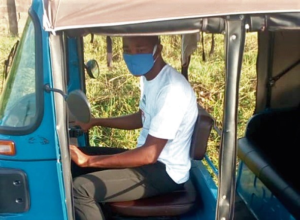 Mr Robert Alavi in his tricycle