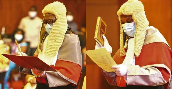 Justice Clemence Jackson Honyenuga (left) and  Justice Issifu Omoro Tanko Amadu (right) Supreme Court Judges swearing the oath of secrecy at the ceremony Pictures: SAMUEL TEI ADANO•