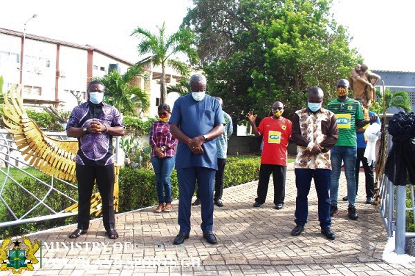 Deputy Youth and Sports Minister, Perry Okudzeto, leads dignitaries to observe a minute silence last Saturday
