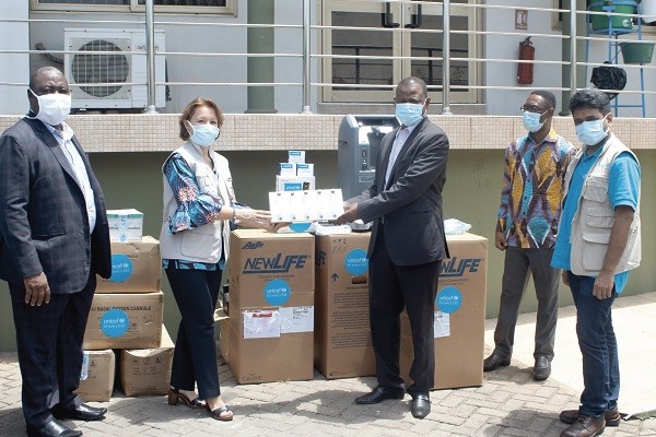  Ms Anne Claire Dufay (2nd left) presenting the items to Dr Patrick Kuma-Aboagye (middle). Those in the picture include Dr Ebenezer Badu Sarkodie (left), Director, Public Health of the GHS. Picture: GABRIEL AHIABOR