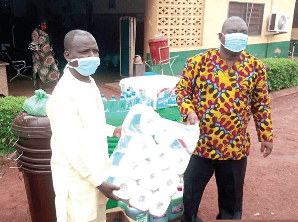 Alhaji Sintaro Mahama (left) presenting the items to Mr Abdulai Fatawu