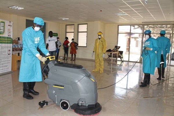 Some members of the Contract Cleaners Association of Ghana cleaning the out-patient department of the Ga East Municipal Hospital.