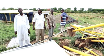 Mr Hisham (right) leading the NADMO officials to inspect the damaged 100-acre centre pivot irrigation system