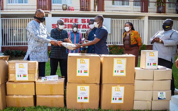 Dr Matthew Opoku Prempeh (right) receiving the items from Mr Andrew Kufuor