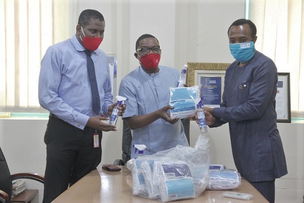  Mr Jerry Ahmed Shaib (right) presenting the items to Mr Kobby Asmah (2nd right). Looking on is Mr Franklin Sowa. Picture: EDNA SALVO-KOTEY