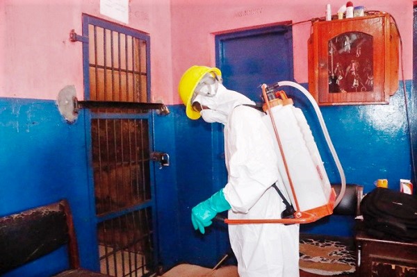 A member of the spraying gang of Zoomlion undertaking the disinfection exercise
