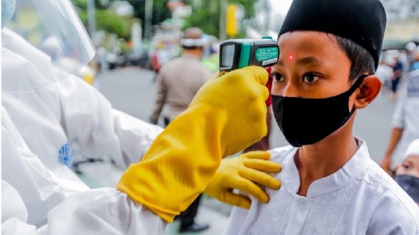 Some worshippers in Indonesia had their temperature checked before attending prayers