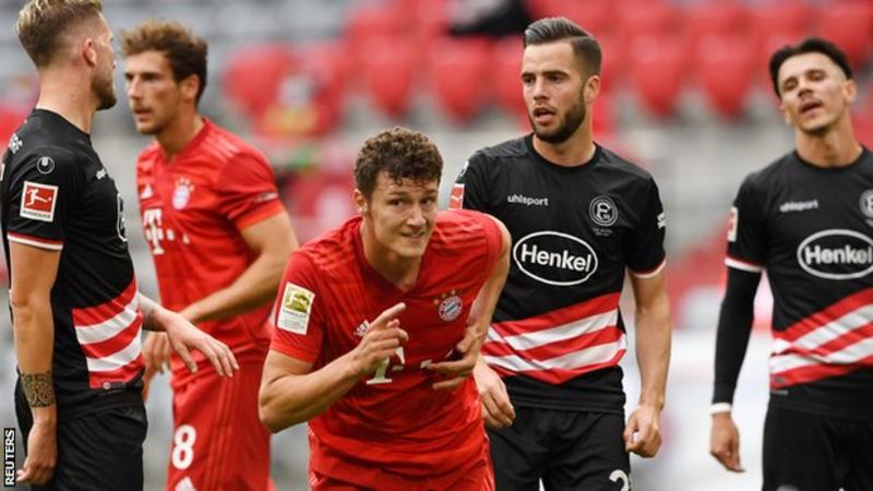 Defender Benjamin Pavard (centre) has scored two goals in four games since the Bundesliga season resumed earlier this month