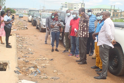 Mr Seth Kudzordzi (with raised hand) explaining a point to Mr Samuel Atta Akyea (3rd left) at the Weija Old Barrier.Mr Seth Kudzordzi (with raised hand) explaining a point to Mr Samuel Atta Akyea (3rd left) at the Weija Old Barrier.