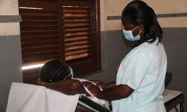 Ms Dorcas Osafo (right), a nurse from the Franklyn Medical Centre, examining the breast of a resident of Adabraka in Accra during the screening exercise. Picture: ESTHER ADJEI
