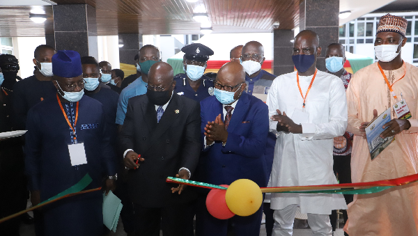 President Akufo-Addo cutting the tape to inaugurate the building. With him are Prof. Mike Oquaye (middle), Speaker of Parliament; Mr Osei Kyei Mensah-Bonsu (left), Mr Haruna Iddrisu (2nd right) and Mr Muntaka Mubarak (right)