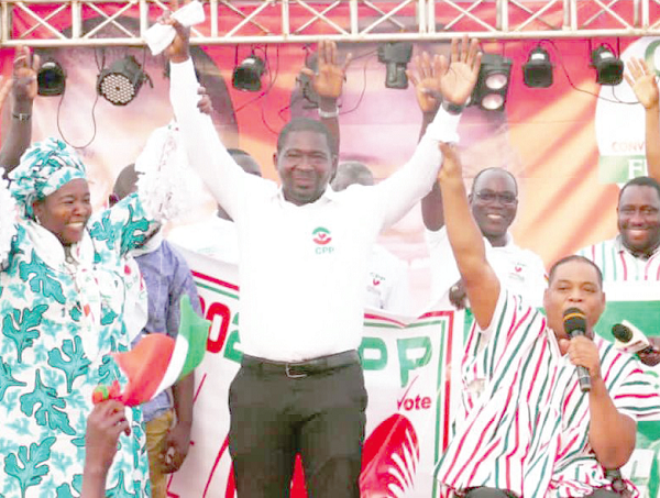 Mr Greenstreet (right) introducing Mr Ekye Kwesie (left), the CPP parliamentary candidate for Jomoro, to the party members
