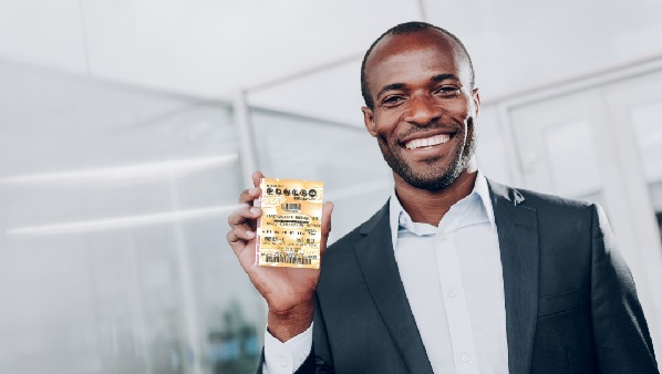 A man displaying a Powerball lottery ticket
