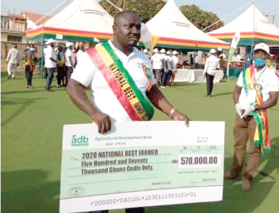 Mr Solomon Kusi poses with his overall prize dummy cheque for GHC 570,000