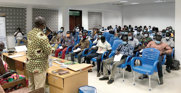 Mr Samuel Asare Ankamah (back to camera), Western South CHED Regional Manager, speaking at the seminar