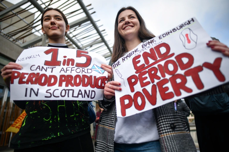 Campaigners and activists rally outside the Scottish Parliament in support of the Scottish Governments Support For Period Products Bill [Jeff J Mitchell/Getty Images]
