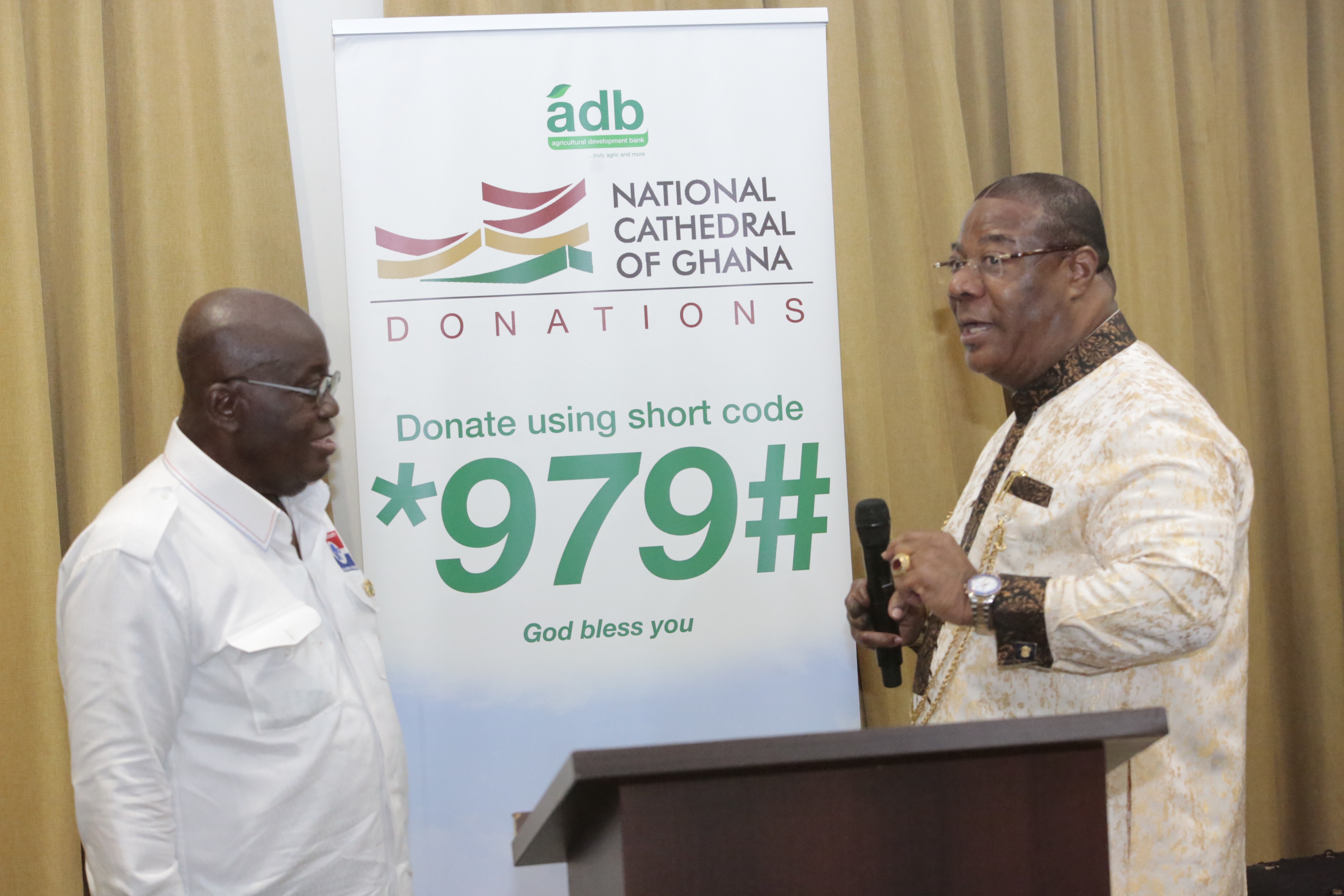 President  Akufo-Addo launching the Cathedral Donation Code, while Archbishop Nicholas Duncan-Williams, member of the Board of  Trustees of the National Cathedral, looks on. Picture: Samuel Tei Adano