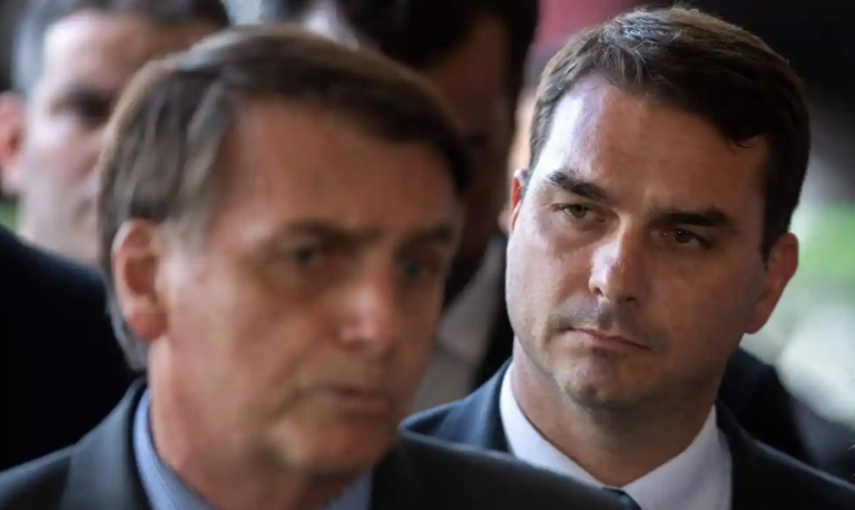 Jair Bolsonaro (left) and his eldest son, Flávio Bolsonaro. Photograph: Sergio Lima/AFP/Getty