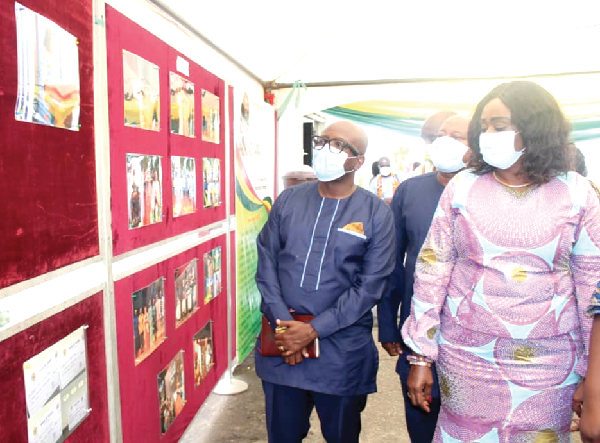 Mrs Barbara Oteng-Gyasi (right), the Minister of Tourism, Arts and Culture, being conducted round a photo exhibition mounted at the event. Picture: Patrick Dickson 