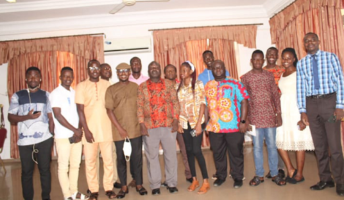 Mr Archibald Adams, head of communications and advocacy unit of PPAG (standing) speaking at the trading workshop. Picture two is a group picture of participants and resources persons at the orientation workshop.
