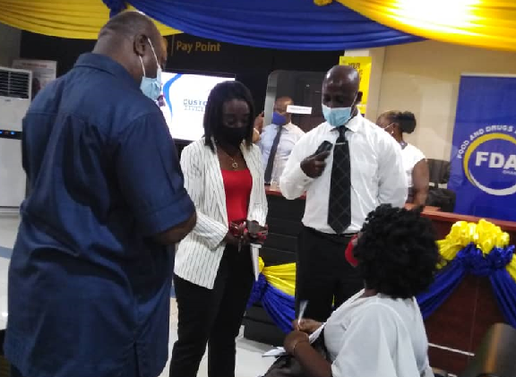 Mrs. Mimi Delese Darko (2nd left) interacting with some clients