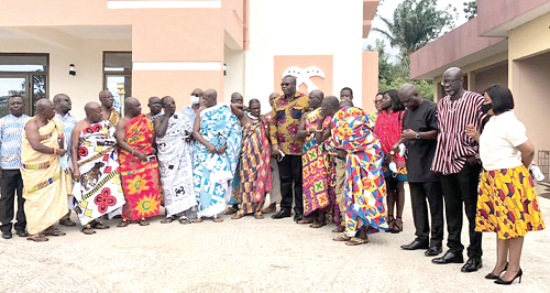 Mr Egbert Faibille Jnr (arrowed) with the chiefs and some staff of the Petroleum Commission