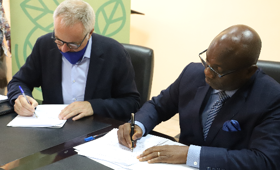 Mr. Anjo Van Toorn (left) signing the MoU with Mr. Bright Wireko Brobby. Picture: GABRIEL AHIABOR