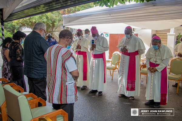 Most Rev. Naameh (arrowed) praying for Mr Rawlings and the Agbotui family