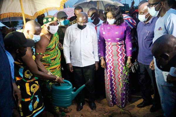  Nana Bobie Ansah II (3rd left), the Chief of Bonwire, watering a commemorative tree during the sod cutting ceremony. Those looking on  include Dr Mahamudu Bawumia and Mrs Barbara Oteng-Gyasi.