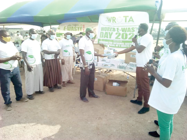  Mr Gilbert Odjidja (with mic) making the presentation to Mr Mohammed Ali