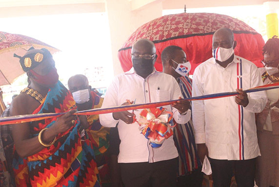 Dr Bawumia (middle) cutting the tape to inaugurate the new boys’ dormitory for the Nkenkansu SHS in the Offinso North District in the Ashanti Region. With him are Mr Collins Ntim (right), the MP for Offinso North, and Dr Nana Kwaku Duah (in Kente), the Offinso Nifahene. Pictures: EMMANUEL BAAH