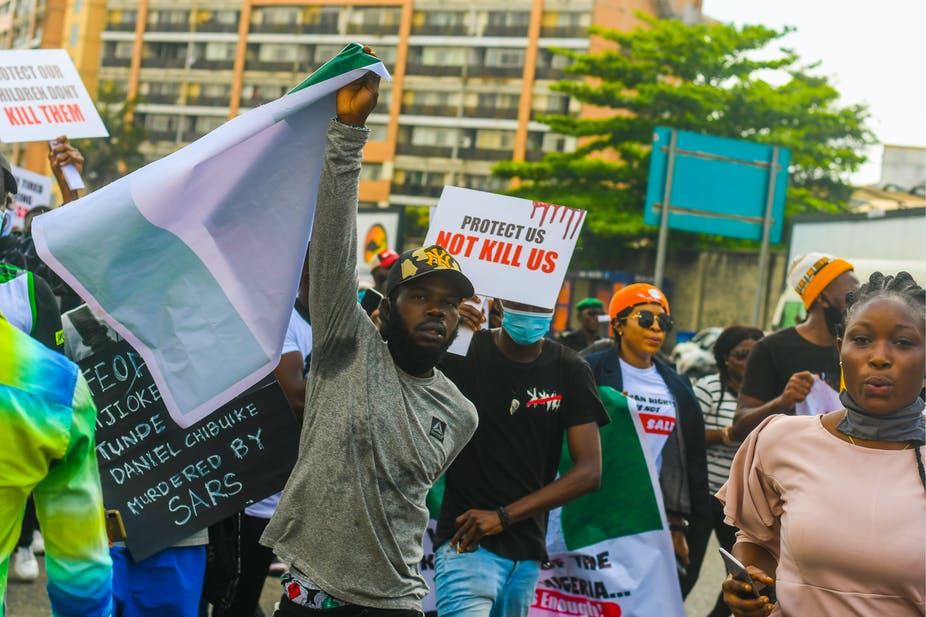 Young Nigerians protesting against the excesses of a special police squad in the country. Shutterstock
