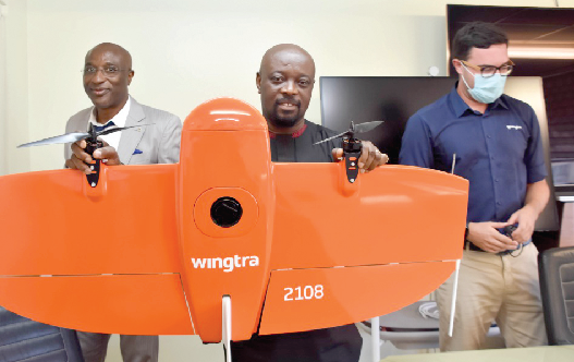 Mr. Kwame Agyeman-Budu examining one of the drones after receiving them from officials of Sahara Natural Resources