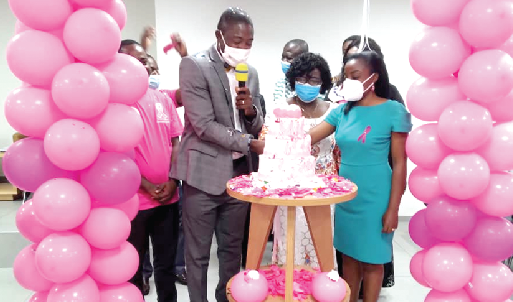 Dr. Okoe Boye and other officials of the ministry cutting a cake to signify the start of the campaign 
