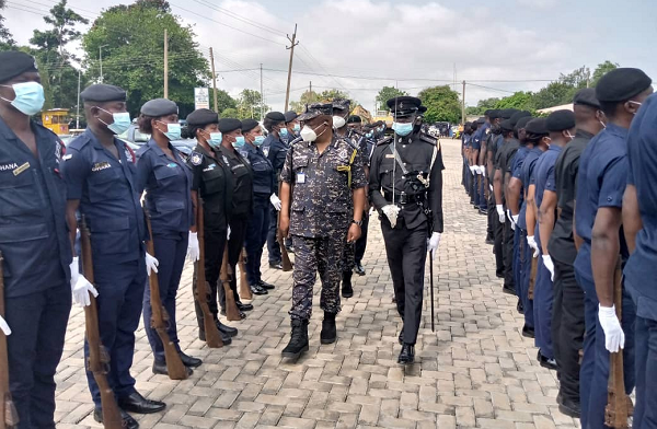 The IGP, Mr James Oppong-Boanuh (left) inspecting a parade at the Eastern Regional Police Command Headquarters.